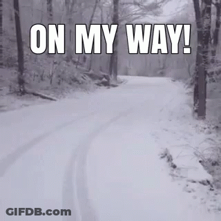 A Snowy Road In The Woods With The Words On My Way GIF