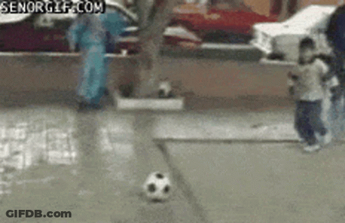 A Soccer Ball Is Being Kicked On A Sidewalk With A Senorgif.com Watermark GIF