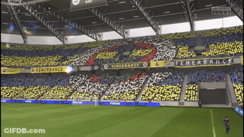 A Soccer Field With A Banner That Says Fenerbahce GIF