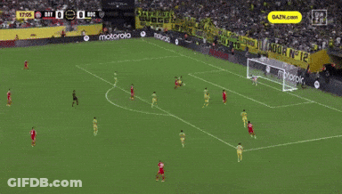A Soccer Field With A Motorola Banner On The Side GIF