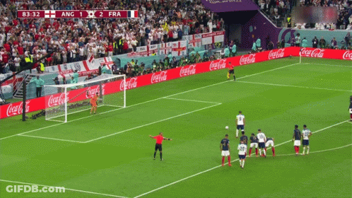 A Soccer Field With Coca Cola Advertisements On The Side GIF