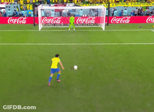 A Soccer Field With Coca Cola Advertisements On The Side GIF