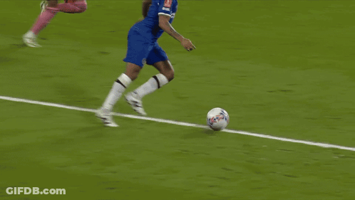 A Soccer Field With Emirates Fly Better Signs GIF