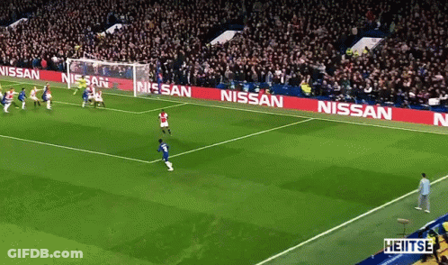 A Soccer Field With Nissan Advertisements On The Side GIF