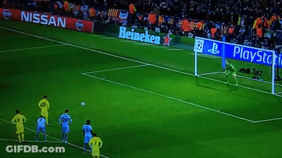 A Soccer Field With Nissan And Heineken Ads On The Side GIF