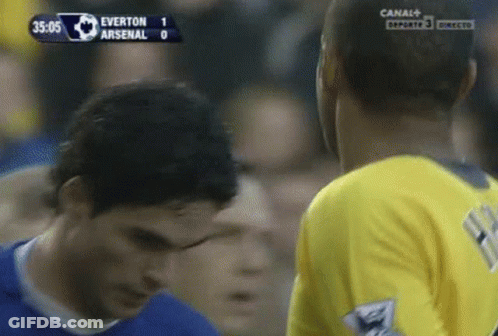 A Soccer Game Between Everton And Arsenal Is Being Played On Canal + GIF
