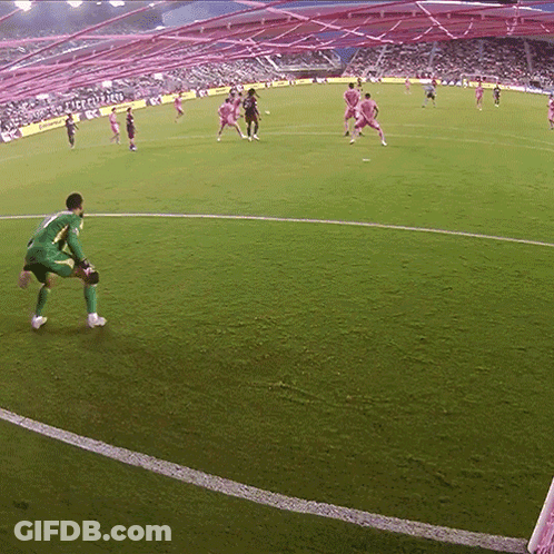 A Soccer Game Is Being Played In A Stadium That Has A Sign That Says ' Liverpool ' On It GIF