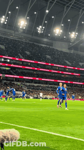 A Soccer Game Is Being Played In A Stadium That Says ' Manchester United ' On The Side GIF
