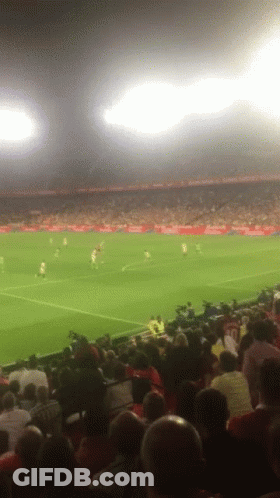 A Soccer Game Is Being Played In A Stadium With A Coca Cola Advertisement GIF