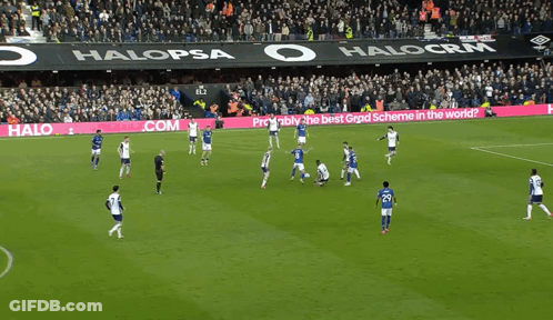 A Soccer Game Is Being Played In A Stadium With A Halo Graduates.com Banner On The Sidelines GIF
