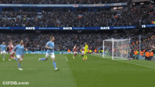 A Soccer Game Is Being Played In A Stadium With A Hays Ad In The Background GIF