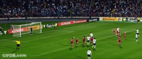 A Soccer Game Is Being Played In A Stadium With Advertisements For Konami And Adidas GIF