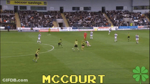 A Soccer Game Is Being Played In A Stadium With The Name Mccourt On The Screen GIF