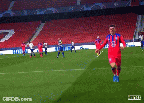 A Soccer Game Is Being Played In An Empty Stadium With Advertisements For Gazprom GIF
