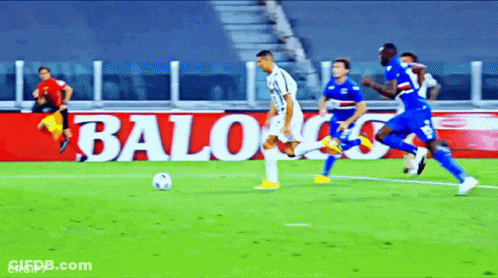 A Soccer Game Is Being Played In Front Of A Banner That Says Baloo GIF