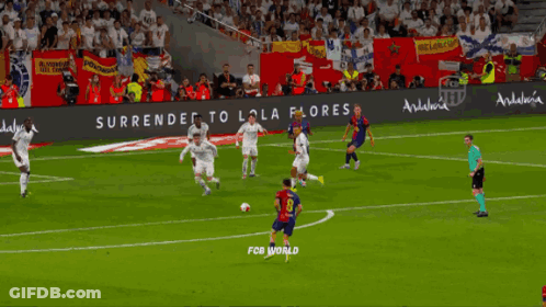 A Soccer Game Is Being Played In Front Of A Banner That Says Fcb World GIF