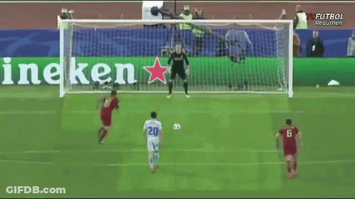 A Soccer Game Is Being Played In Front Of A Banner That Says Heineken GIF