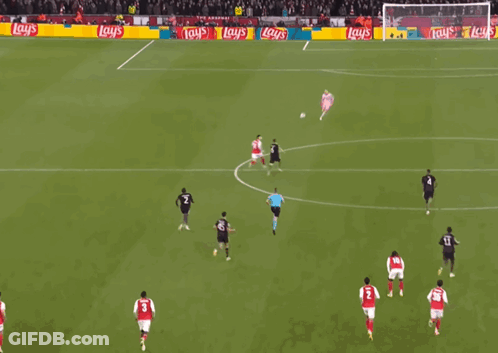 A Soccer Game Is Being Played In Front Of A Banner That Says Lay 'S GIF