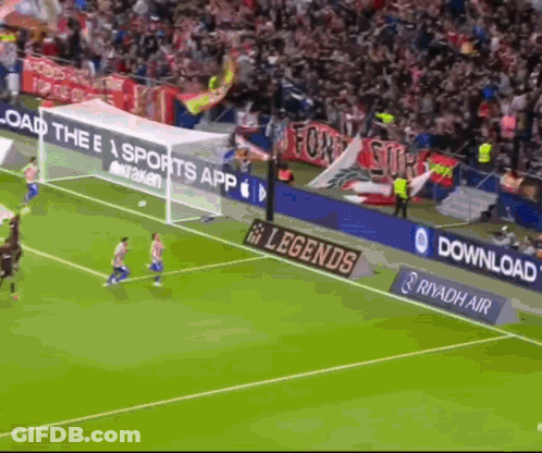 A Soccer Game Is Being Played In Front Of A Banner That Says Legends GIF