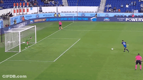 A Soccer Game Is Being Played In Front Of A Banner That Says Power GIF