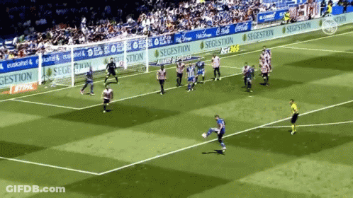 A Soccer Game Is Being Played In Front Of A Banner That Says Segestion GIF