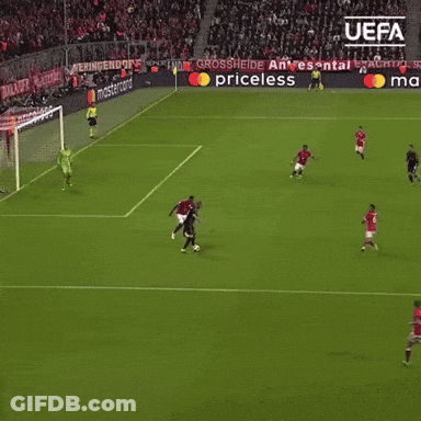A Soccer Game Is Being Played In Front Of A Banner That Says Uefa GIF