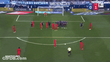 A Soccer Game Is Being Played In Front Of A Banner That Says Vonovia GIF