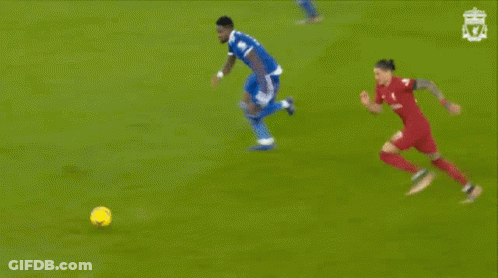 A Soccer Game Is Being Played In Front Of A Coca-Cola Advertisement GIF