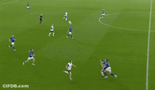 A Soccer Game Is Being Played In Front Of A Crowd And A Scoreboard That Says Premier League On It GIF