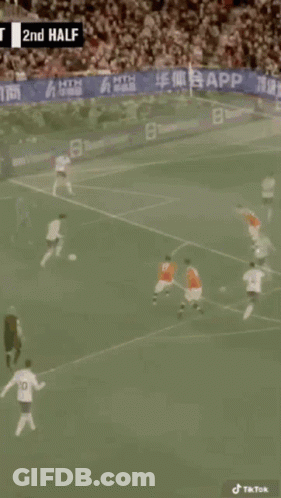 A Soccer Game Is Being Played In Front Of A Crowd With A Banner That Says App On It GIF