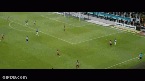 A Soccer Game Is Being Played In Front Of A Crowd With A Sign That Says Emirates GIF