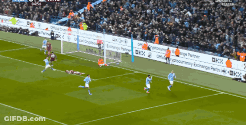 A Soccer Game Is Being Played In Front Of A Crowd With Advertisements For Cryptocurrency Exchange Partners GIF