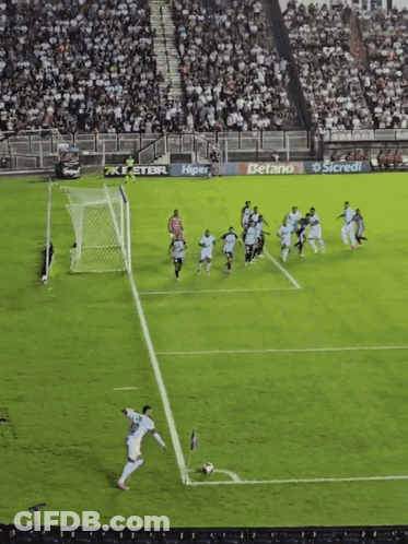 A Soccer Game Is Being Played In Front Of A Crowd With Advertisements For Detano And Sicredi GIF