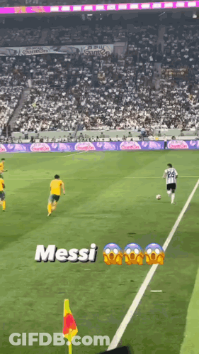 A Soccer Game Is Being Played In Front Of A Crowd With The Word Messi On The Field GIF