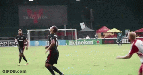 A Soccer Game Is Being Played In Front Of A Heineken Sign GIF