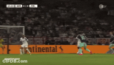 A Soccer Game Is Being Played In Front Of A Large Continental Ad GIF