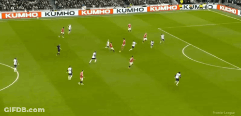 A Soccer Game Is Being Played In Front Of A Large Crowd And A Banner That Says Official Fan Token GIF