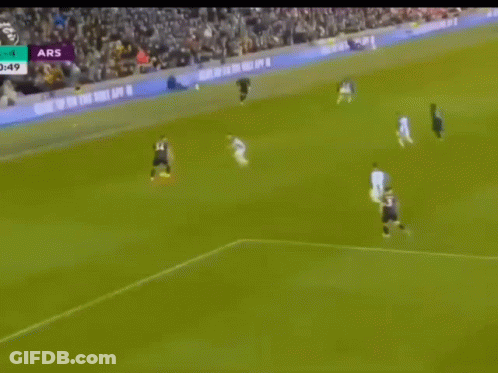 A Soccer Game Is Being Played In Front Of A Large Crowd And The Score Is Ars 4 To 4 GIF