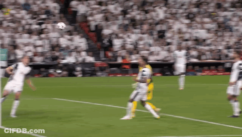A Soccer Game Is Being Played In Front Of A Large Crowd GIF