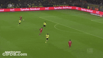 A Soccer Game Is Being Played In Front Of A Large Flyeralarm Banner GIF
