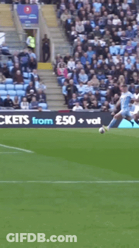 A Soccer Game Is Being Played In Front Of A Large Sign That Says ' Large Tickets ' GIF