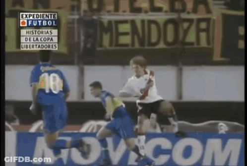 A Soccer Game Is Being Played In Front Of A Mendoza Banner GIF