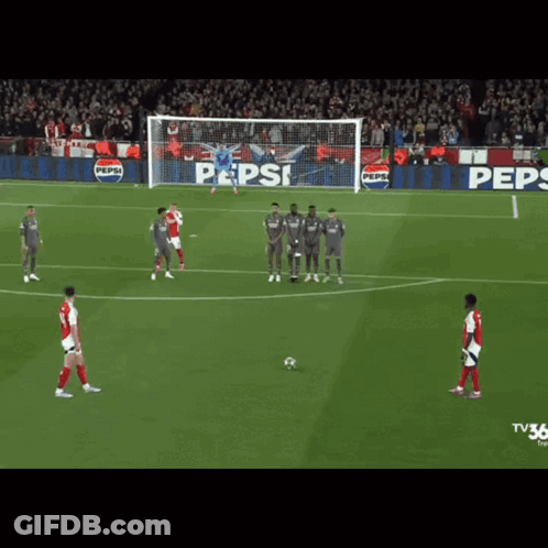 A Soccer Game Is Being Played In Front Of A Pepsi Ad GIF
