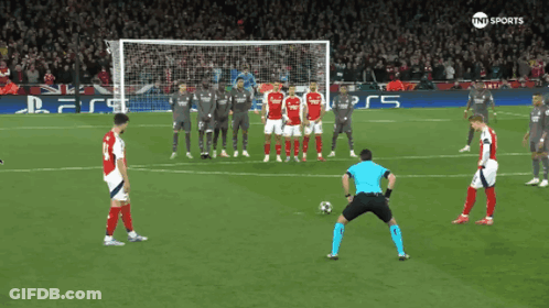 A Soccer Game Is Being Played In Front Of A Playstation Sign GIF