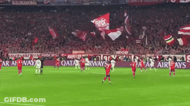 A Soccer Game Is Being Played In Front Of A Qatar Airways Ad GIF