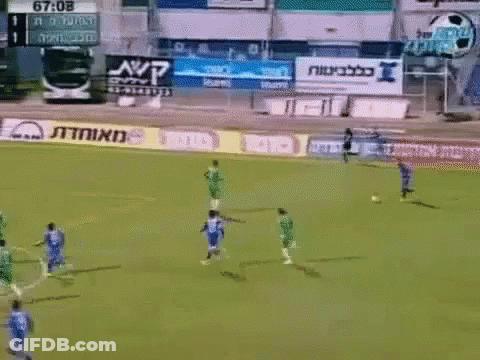 A Soccer Game Is Being Played In Front Of A Scoreboard That Says 67-08 On It GIF