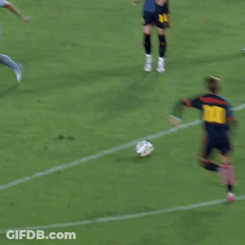 A Soccer Game Is Being Played In Front Of A Sign For Adidas GIF