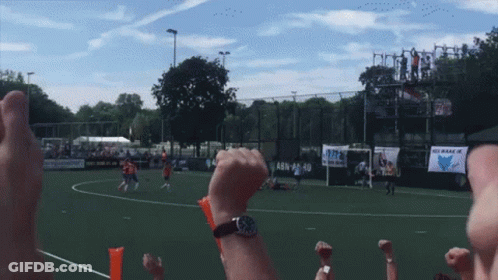 A Soccer Game Is Being Played In Front Of A Sign That Says Abn 24-10 GIF