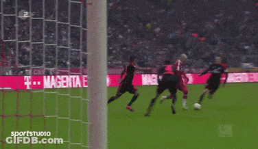 A Soccer Game Is Being Played In Front Of A Sign That Says Magenta GIF