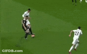 A Soccer Game Is Being Played In Front Of A Sign That Says ' Pdnsibly ' On It GIF